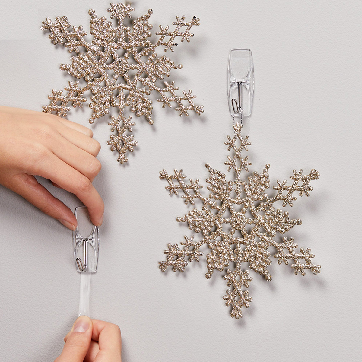 Hanging snowflake balloons from the ceiling! Use 3M command hooks